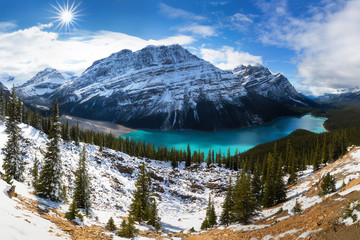 Winter day on the Peyto lake. Lake is a glacier-fed lake in Banff National Park in the Canadian Rockies. The lake itself is easily accessed from the Icefields Parkway. Amazing landscape background