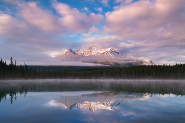 Lake Herbert panorama in a foggy morning with glaciers mountain and reflection in Banff National Park, Canada The Canadian Rockies or Canadian Rocky Mountains. Amazing landscape concept 