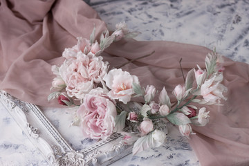 Pink silk flower wedding wreath on white background