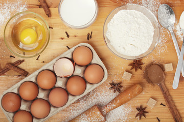 Food ingredients for baking: flour, eggs, milk, sugar