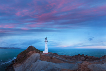 Castle Point lighthouse, located near the village of Castlepoint in the Wellington Region of the North Island of New Zealand, is the North Island's tallest lighthouse. Beautiful landscape background - obrazy, fototapety, plakaty