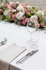 Beautiful floral arrangement on the table in the restaurant on the wedding day