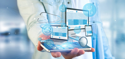 Businessman holding Devices with medical icon and stethoscope 3d rendering