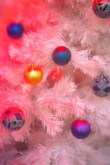 Fototapeta na wymiar Christmas decorations on a white plastic tree