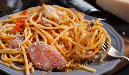 Pasta with chunks of fresh tuna, tomato and capers