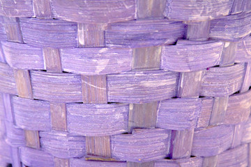 Horizontal texture of decorative lilac wicker wooden basket. Violet background with retro effect © Irina Kulikova
