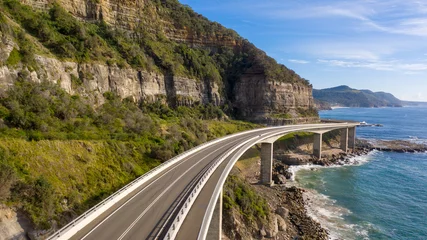  Travelling on the sea cliff bridge coastal drivel along the pacific ocean. Grand pacific drive, East coast of Australia. Clear sunny day. © Southern Creative