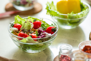 Delicious vegetable salad in glass bowl on the table