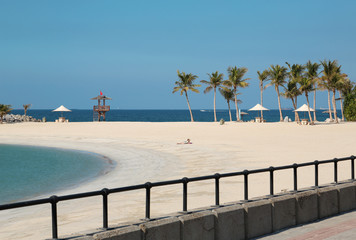 People on the beach near Sharjah city in United Arab Emirates
