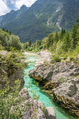 Fototapeta na wymiar Velika Korita or Great canyon of Soca river near Bovec, Slovenia. Beautiful vivid turquoise river stream in Triglav National Park, Julian Alps, Slovenia.