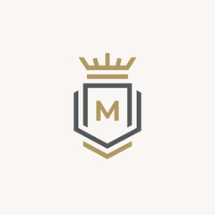 Heraldic Letter M monogram. Elegant minimal logo design. Letter M + Crown + Book + Shield.