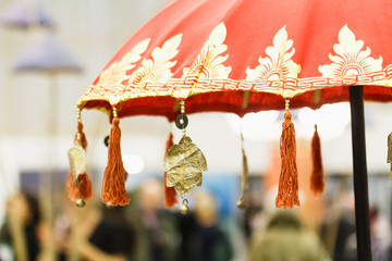 Closeup details of traditional Hindu umbrella with tassels, Indonesia