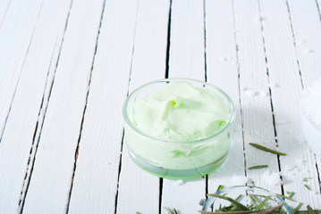 organic face cream anti aging mask on white wood table