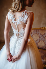 Fototapeta na wymiar Beautiful blonde bride woman in a gorgeous wedding dress, fashion beauty portrait
