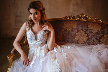 Fototapeta premium Beautiful blonde bride woman in a gorgeous wedding dress, fashion beauty portrait