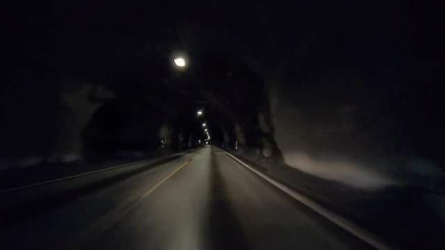 Point of view car driving in a tunnel