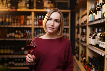 Image of young woman with bottle of wine