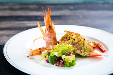 Asian cuisine, sushi, ice cubes, shrimp, salmon, close-up, mint leaves. Fish and meat