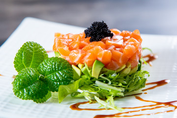 Asian cuisine, sushi, ice cubes, shrimp, salmon, close-up, mint leaves. Fish and meat