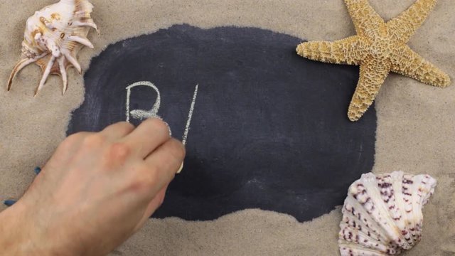 Handwritten word BALI written in chalk, among seashells and stars. Top view.