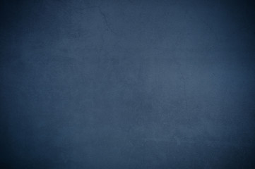 Background wall of aged textured old plaster blue.
