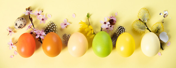 stylish easter flat lay, easter eggs on yellow background