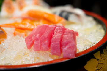 Tuna sliced fish sashimi in ice on plate