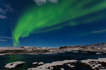 Beautiful panoramic Aurora Borealis or better known as The Northern Lights for background view in Iceland. Jokulsarlon glacier lagoon. Green northern lights Starry sky with polar lights. Arctic circle