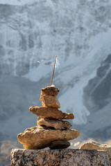 Burning incense in a stone pyramid on the background of the mountain