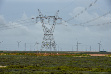 Windmills and electric trellis on a field near Atins, Brazil
