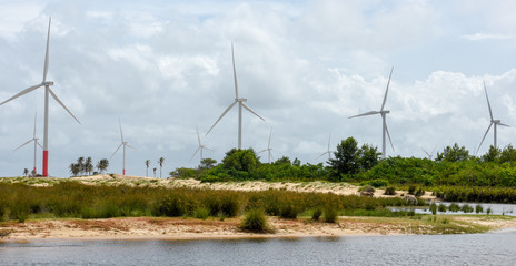 Windmills on the sand dunes of Lencois Maranhenses near Atins, Brazil