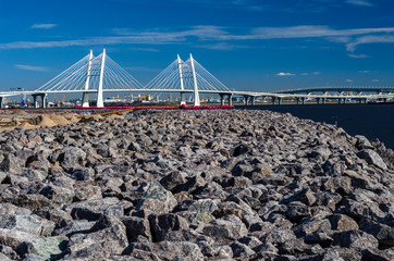 New cable-stayed bridge across the Neva. White large modern bridge on the seafront. St. Petersburg....