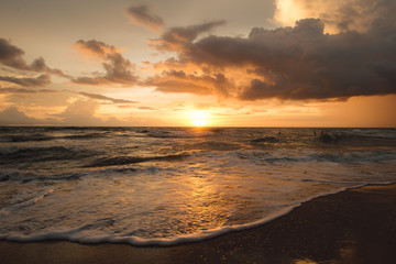 Fototapeta na wymiar Sunset on the beach with beautiful sky . Sunrise on the beach .