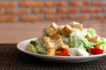 Caesar salad on table