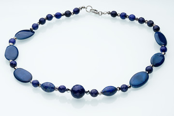 Necklaces, beads, handmade bracelets are made of artificial stone of different breeds.