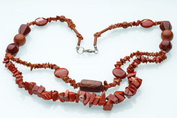 Necklaces, beads, handmade bracelets are made of artificial stone of different breeds.