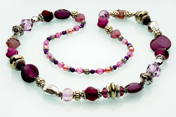Necklaces, beads, handmade bracelets are made of artificial stone of different breeds.