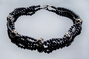 Necklaces, beads, handmade bracelets are made of artificial stone of different breeds.