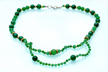 Necklaces, beads, handmade bracelets are made of artificial stone of different breeds.