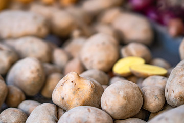 Fresh organic potatoes at the market, close up.