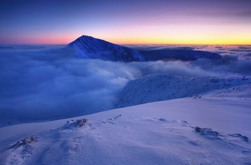 Sunrise view of Pec pod Snezkou in the Krkonose Mountains in winter. Czech Republic. Morning...