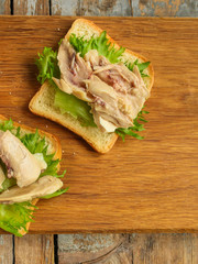 sandwich with chicken and lettuce. food background. copy space