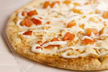 Ranch pizza on cardboard background