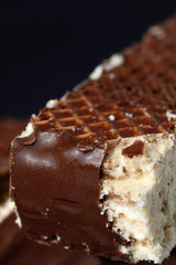 Slice of iced waffle cake closeup. Shallow depth of field
