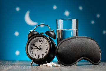 Alarm clock, mask and pills