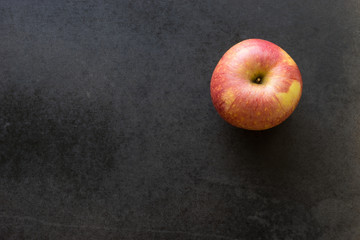 apple on black background,
