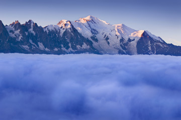 Views of the Mont Blanc glacier above the clouds. Popular tourist attraction. Picturesque and gorgeous scene. Location place Nature Reserve Aiguilles Rouges, Graian Alps, France, Europe. Beauty world.