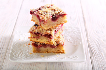 Raspberry crumble bars on plate