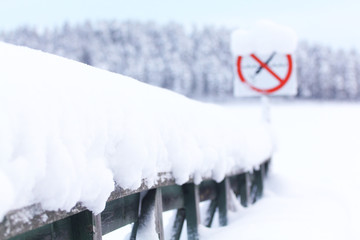 diving sign is prohibited against the background of the winter landscape