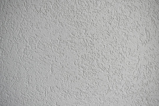 Grey house acrylic plaster facade closeup